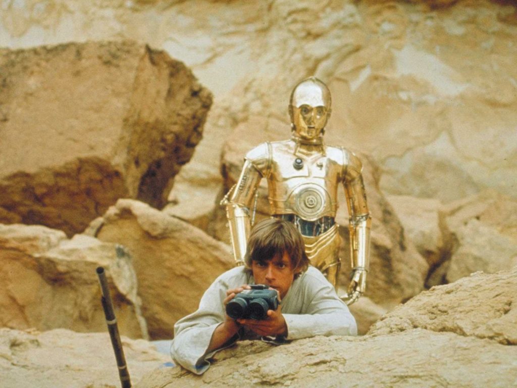 Luke Skywalker (Mark Hamill) and C-3PO (Anthony Daniels) in Star Wars Episode IV, A New Hope